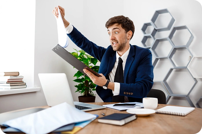 Man reviewing documents at office desk